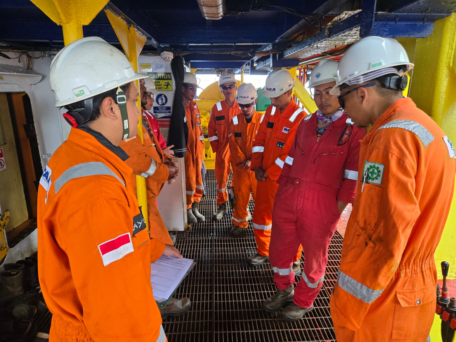 Taka Group engineers and crew aligning operations on vessel deck