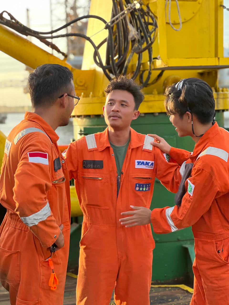 Taka Group young engineers on vessel deck