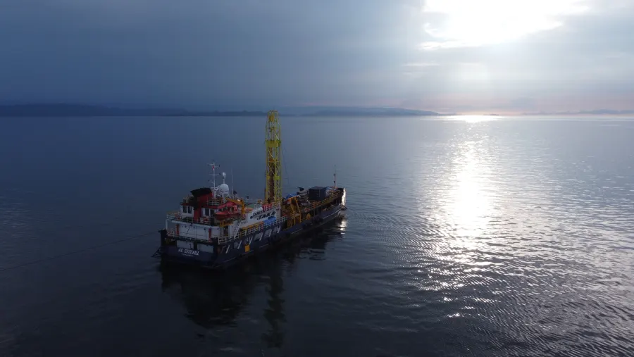 AG Geodrill operating at calm water near sunset